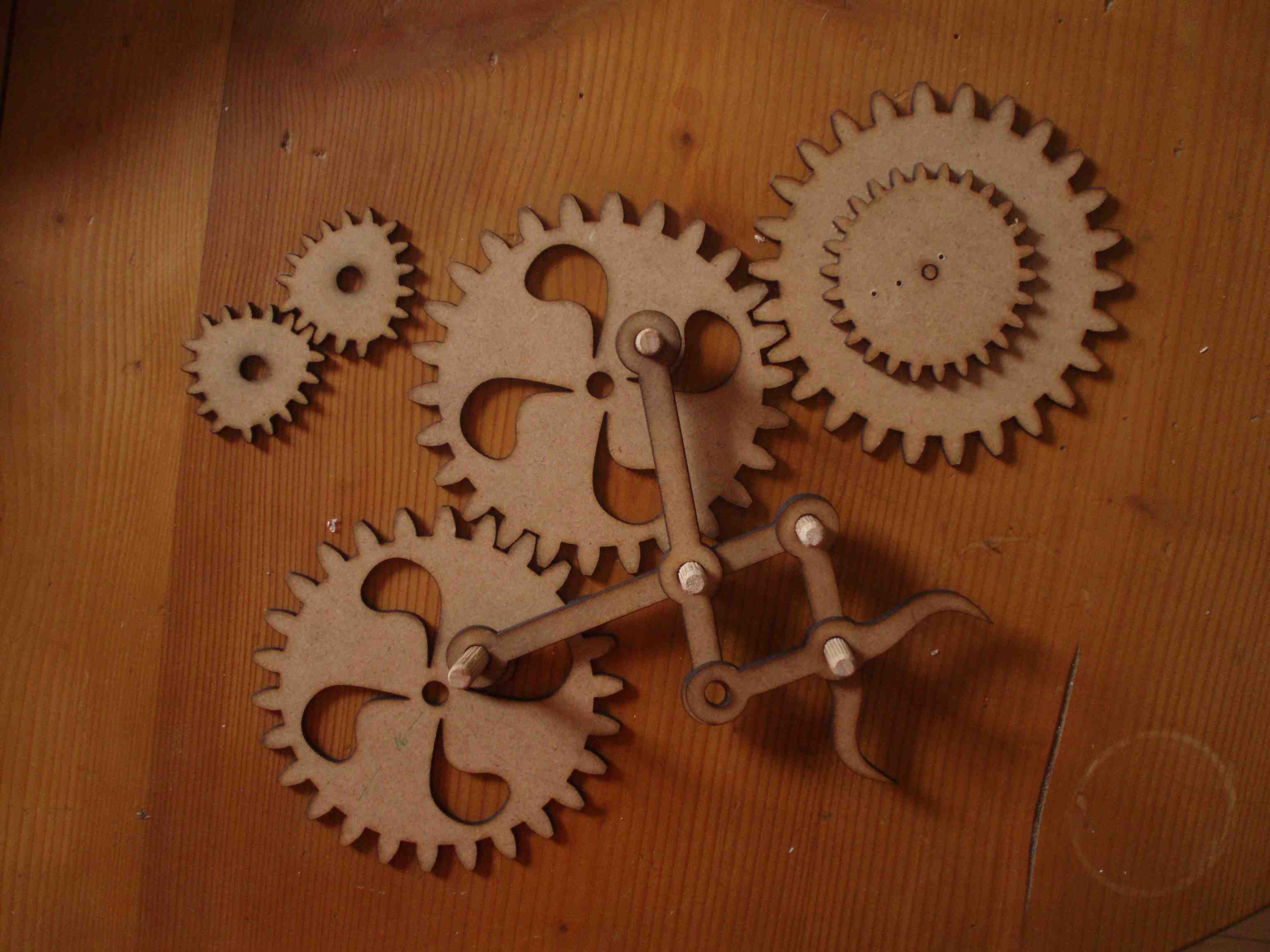 When these gears turn the attached arms open and close.